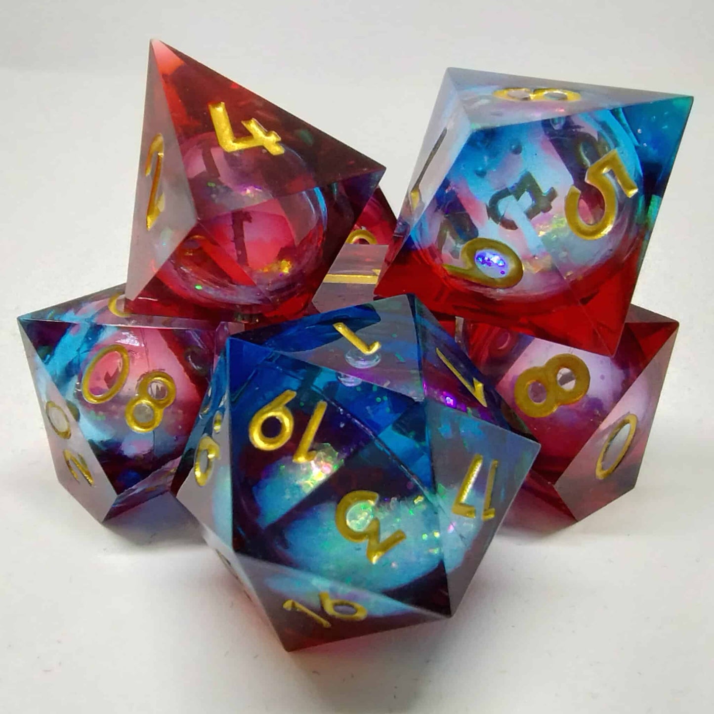 Liquid Core Blue and Red Sharp Edge Resin 7 Piece Dice Set image 0