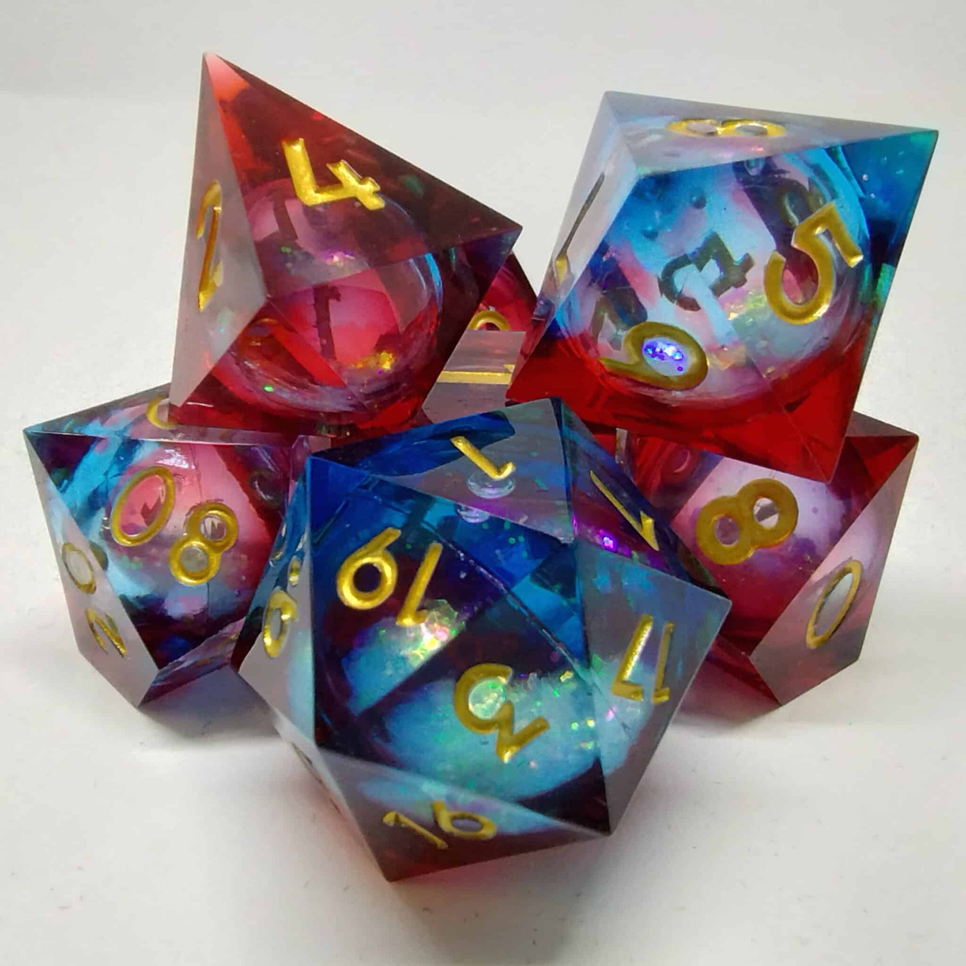 Liquid Core Blue and Red Sharp Edge Resin 7 Piece Dice Set image 0